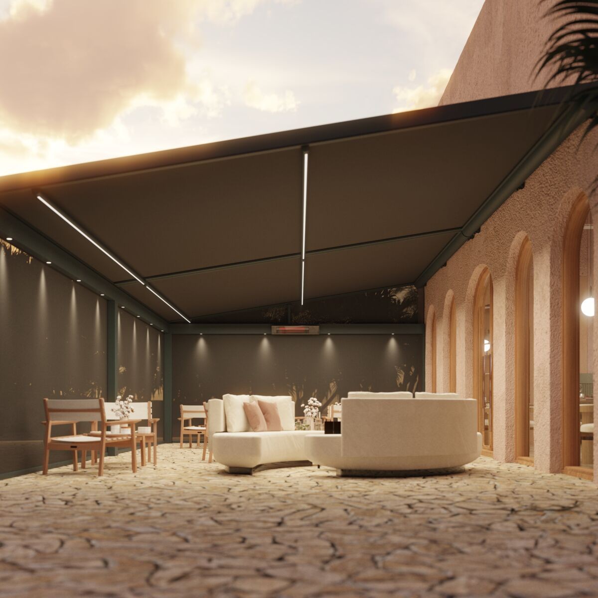 Elegant patio with a modern awning, soft seating, and ambient lighting at sunset.